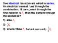 Two identical resistors are wired in series. An electrical current runs through the combination. If